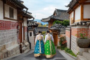 Women wearing hanbok walking through Bukchon Hanok Village Seoul S Korea Prasit photo hMuDaF